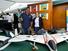 Environmental Science graduate student with advisor and drone