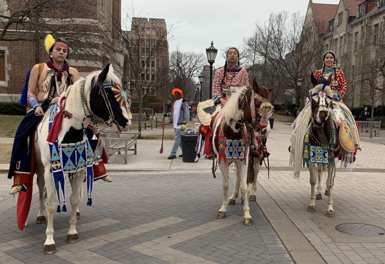 Apsaalooke women participate in a parade at the University of Chicago