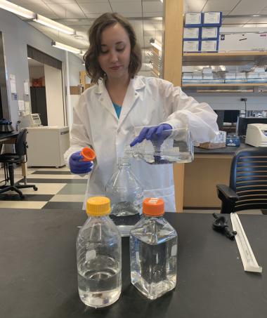 Joy Custer working in a lab